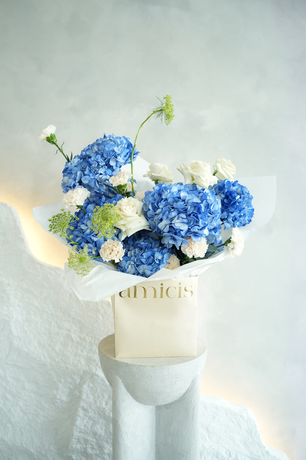 Bouquet of blue and white flowers made by amicis uae