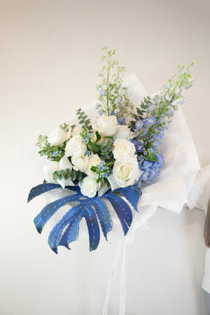 Hand-tied Bouquet of flowers with blue jeans concept curated by amicis flower shop