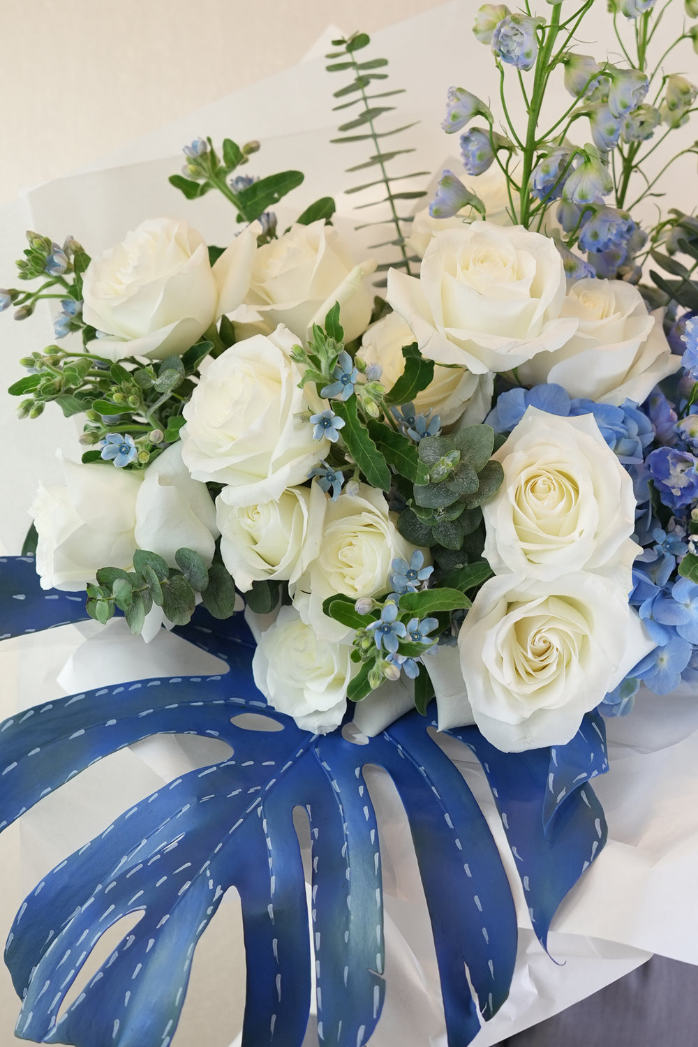 Hand-tied Bouquet of flowers with blue jeans concept curated by amicis flower shop