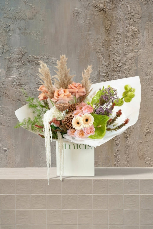 Bijou Blossoms - peach roses, cream gerberas, green anthurium, white amaranthus, and pampas grass