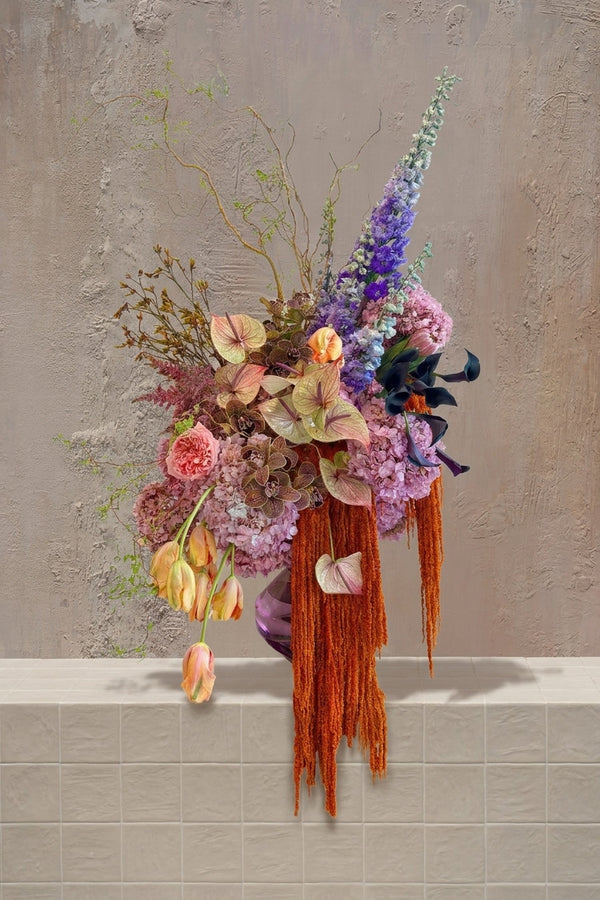 Atelier - artistic mixed bouquet with purple delphinium, pink chrysanthemums, trailing orange amaranthus and berry branches by Amicis