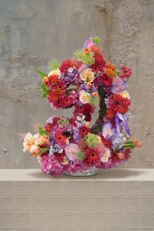Bespoke Letter - hydrangeas, roses, anthurium, and gerberas in vibrant pink, red, orange, and