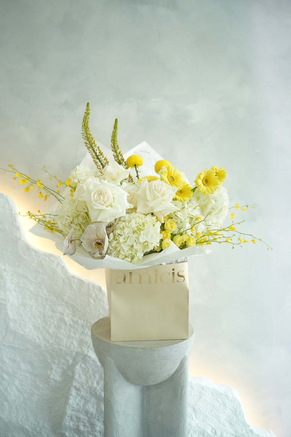 white and yellow flower bouquet with roses and orchids floral by amicis uae