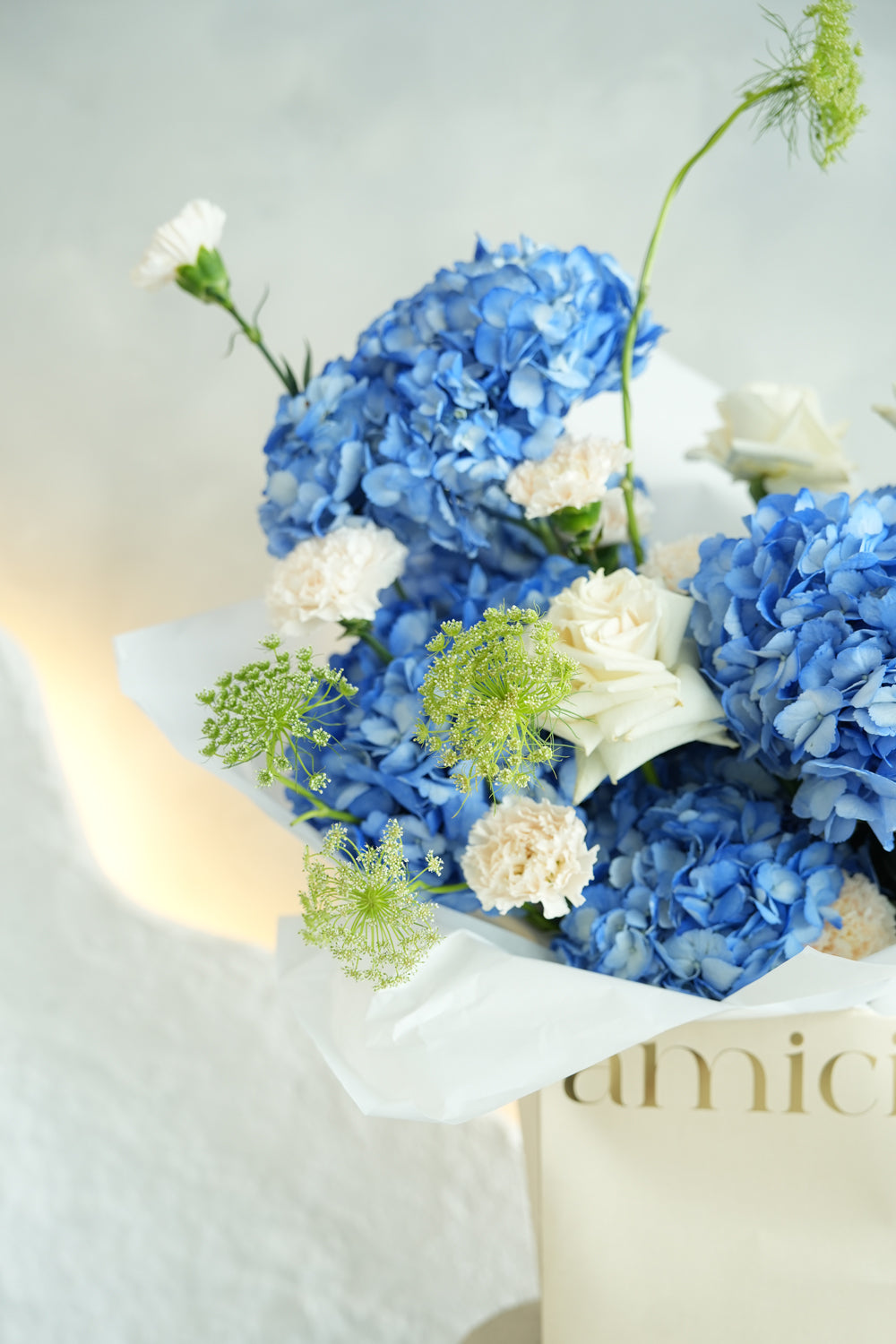 Bouquet of blue and white flowers made by amicis uae