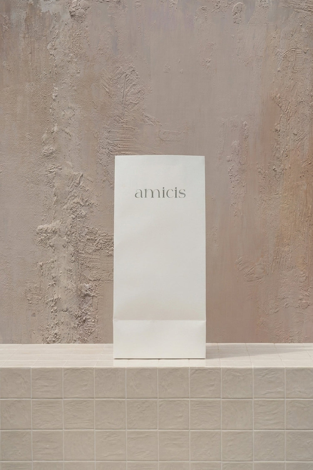Box Tall - elegant white gift box with 'amicis' logo, containing luxury roses and orchids, on a beige background by Amicis