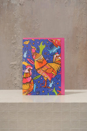 Chicken - bold orange roses, fuchsia carnations, and vibrant yellow gerberas in a hot pink ceramic vase by Amicis
