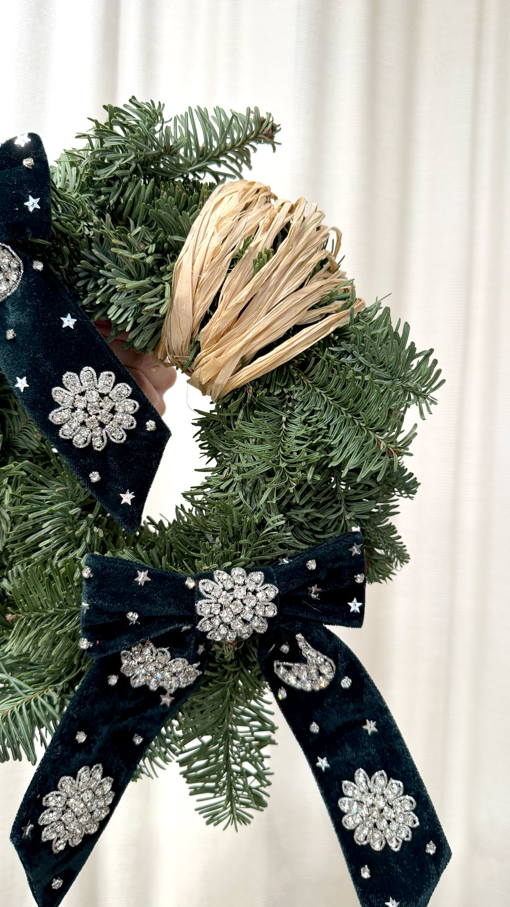 Sparkle Holidays 10 - lush green pine wreath with black velvet bows adorned with silver jewels and a natural straw accent by Amicis