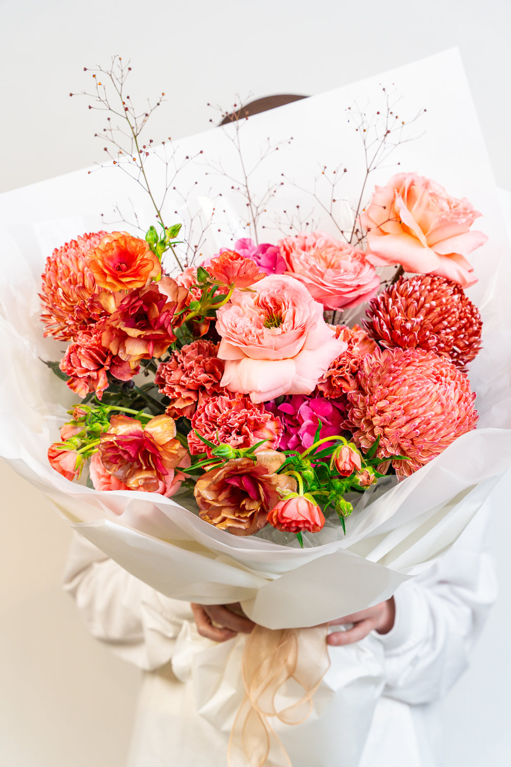 Bold, passionate, and timeless—Scarlet Whisper is a hand-tied bouquet in rich red hues, artfully composed to evoke deep emotion and refined drama. A floral statement of love, strength, and unforgettable elegance.