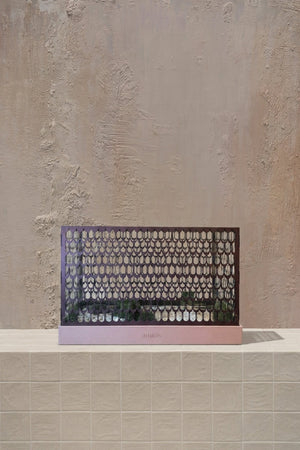 Housewarming Hamper Plain - blush pink base with a dark purple patterned screen, holding minimal green foliage, by Amicis