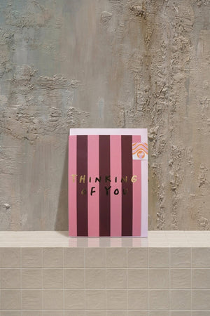 Notecard a - blush pink and deep red striped card with gold "Thinking of You" text, in a light pink envelope by Amicis