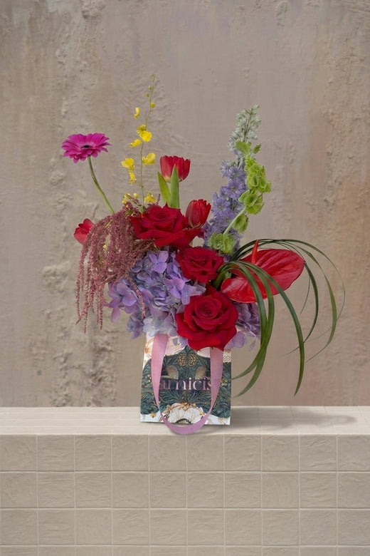 Petal Pop - deep red roses, tulips, anthurium, amaranthus, lavender hydrangeas, pink gerbera, and