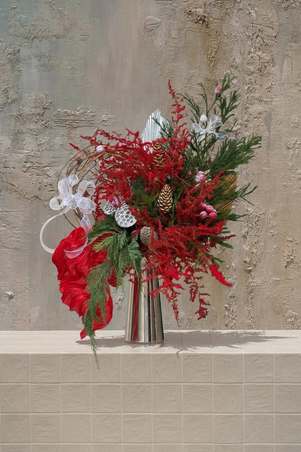 Sparkle Holidays 05 - red amaranthus, pine, gold pinecones, frosted berries, and silver pods in a silver metallic vase by Amicis