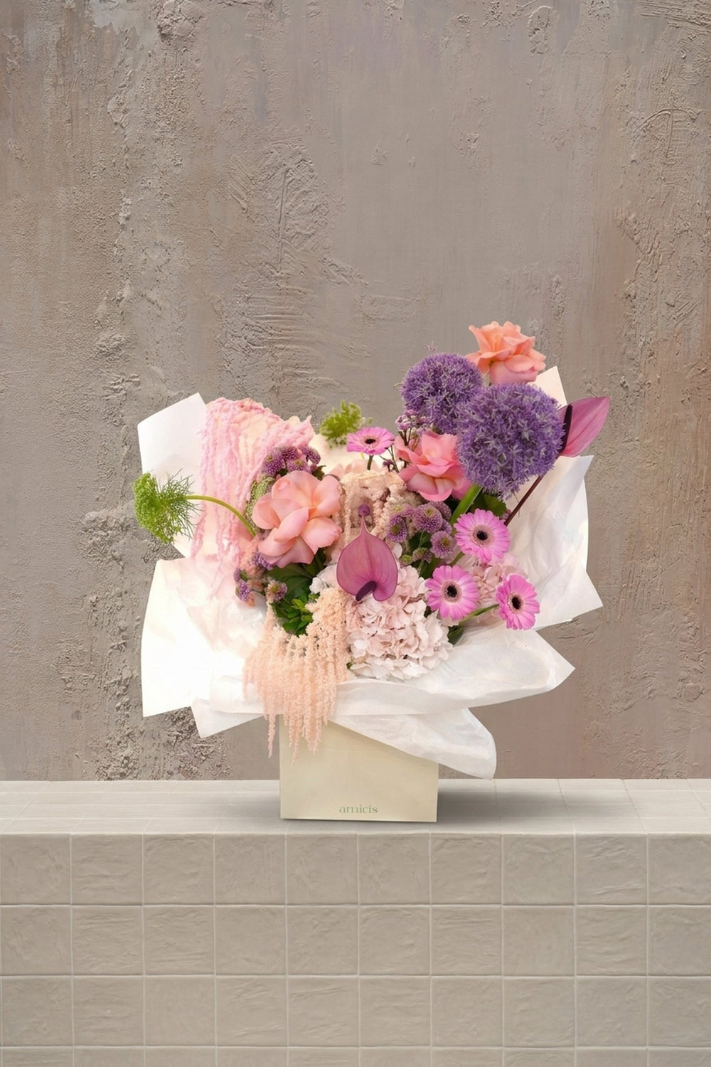 Amicis Blush - blush pink roses, purple alliums, pink gerberas, and trailing amaranthus in a cream gift box by Amicis