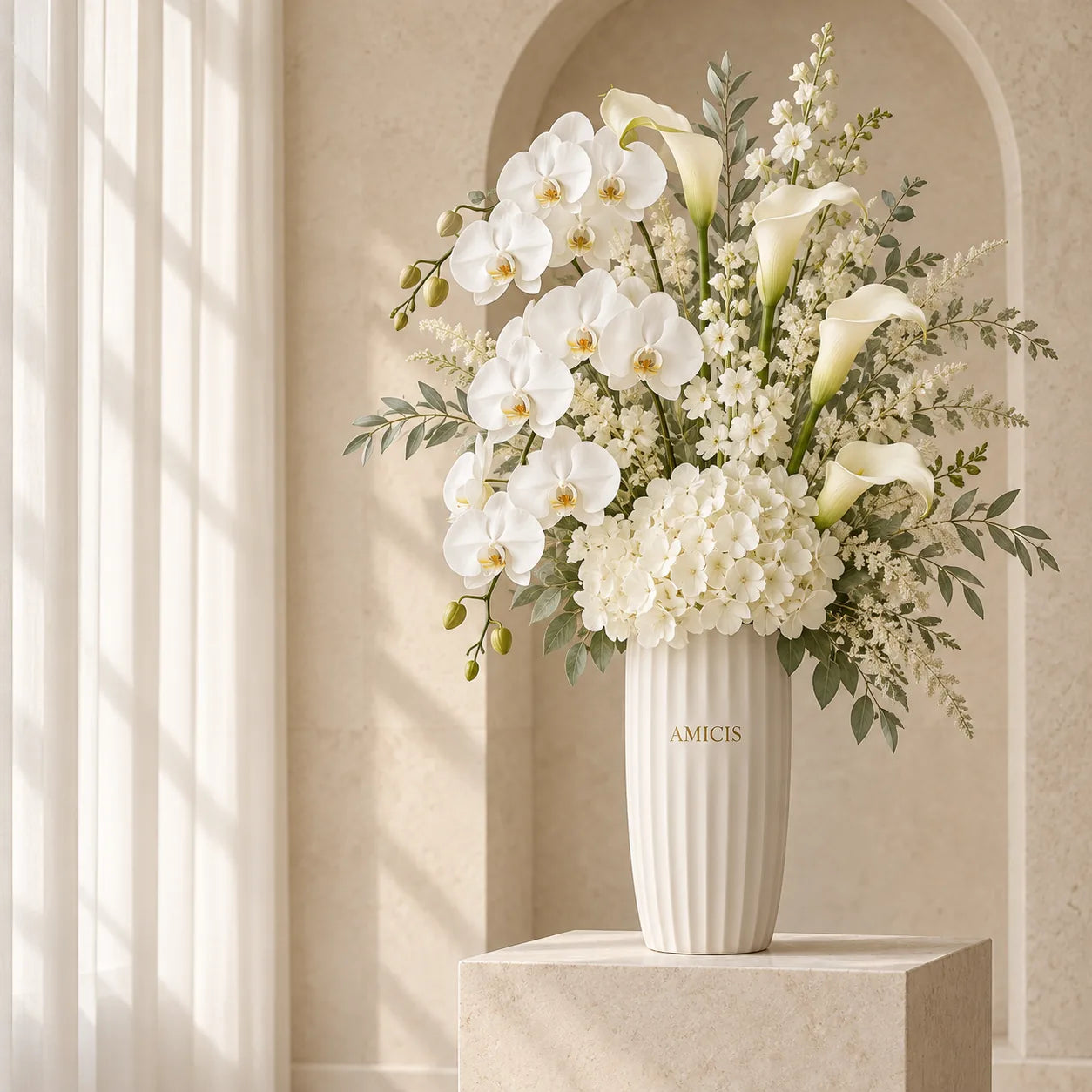 White orchid and calla lily arrangement in a tall Amicis vase for a Dubai hotel lobby