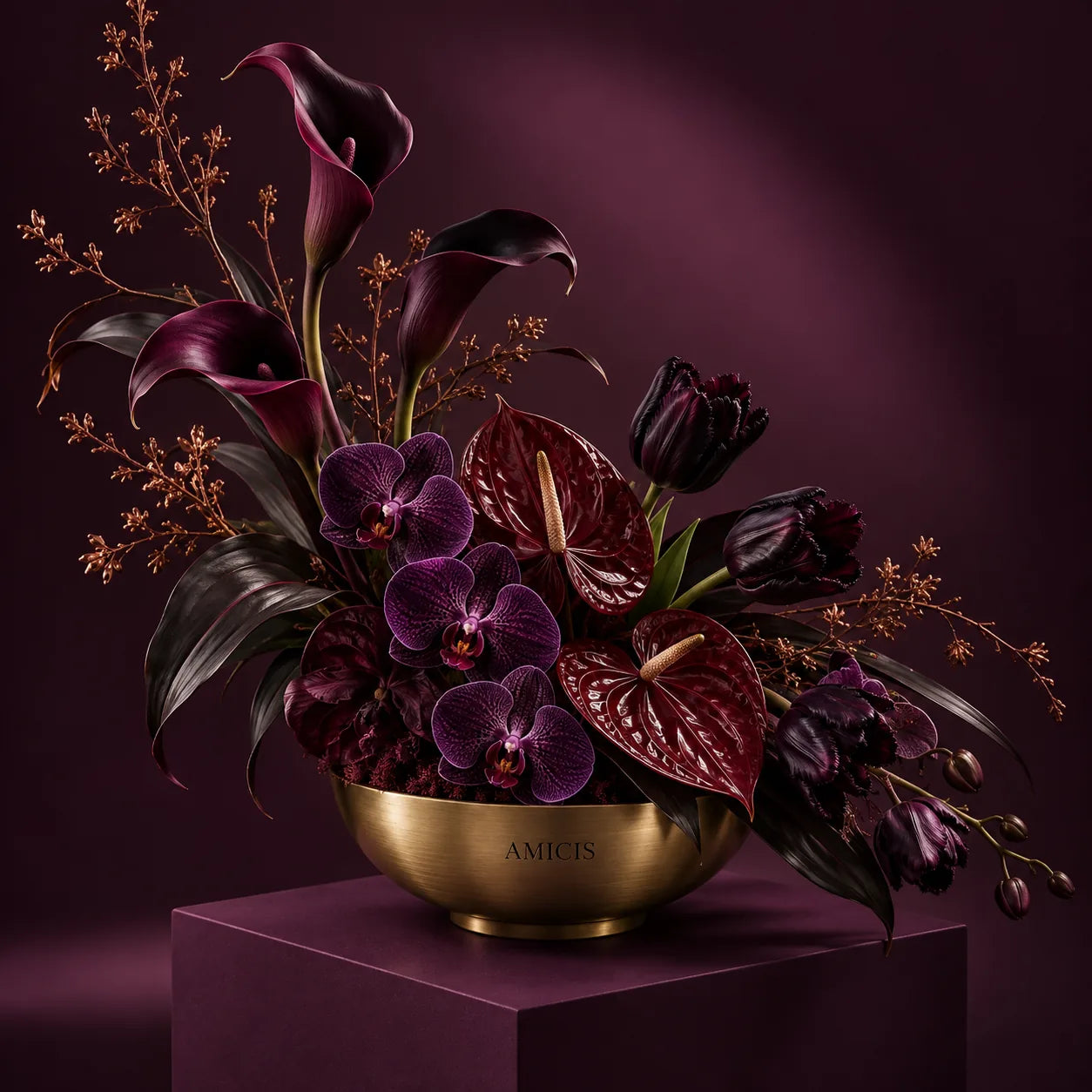 Deep plum orchid and anthurium arrangement in a gold Amicis bowl, delivered to Fujairah